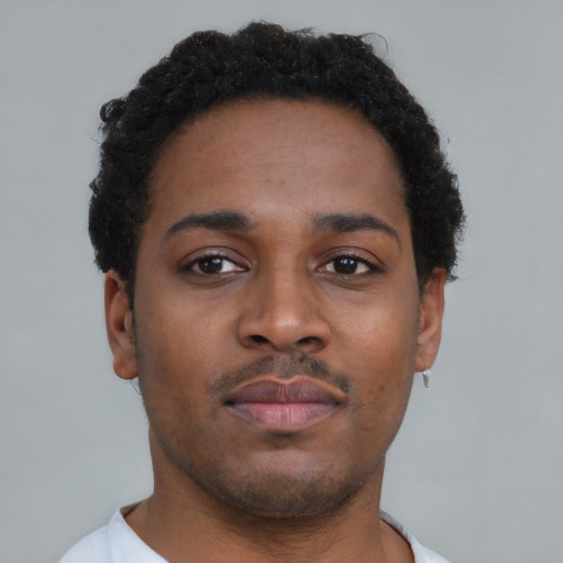 Neutral black young-adult male with short  brown hair and brown eyes