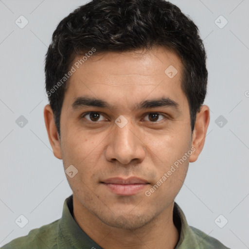 Joyful white young-adult male with short  black hair and brown eyes