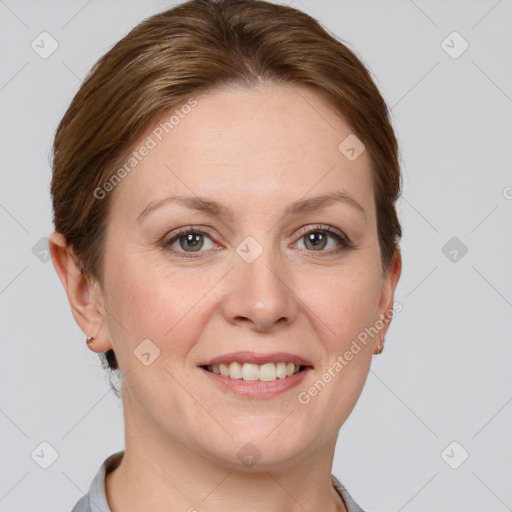 Joyful white young-adult female with short  brown hair and grey eyes