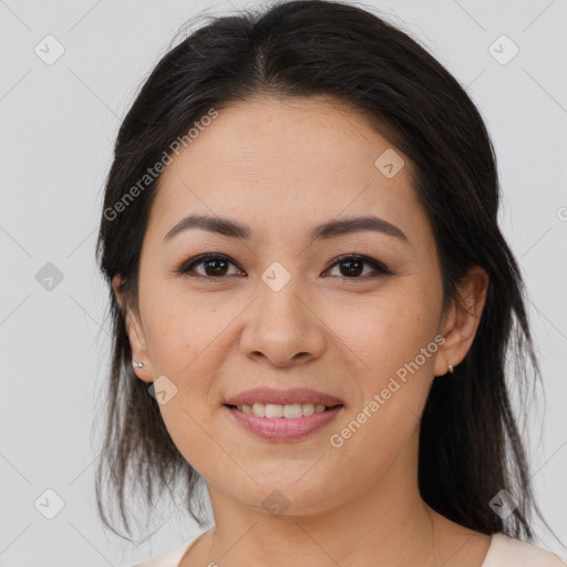 Joyful asian young-adult female with long  brown hair and brown eyes