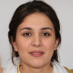 Joyful white young-adult female with medium  brown hair and brown eyes