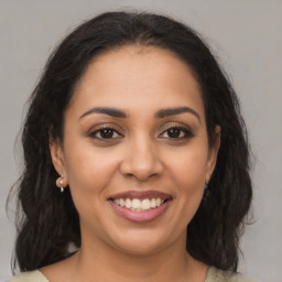 Joyful latino young-adult female with medium  brown hair and brown eyes