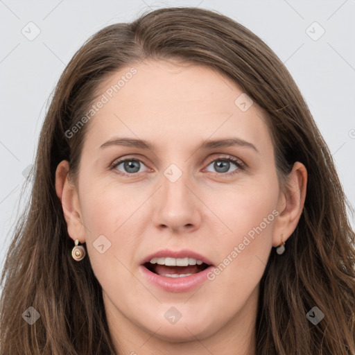 Joyful white young-adult female with long  brown hair and grey eyes