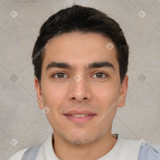 Joyful white young-adult male with short  black hair and brown eyes