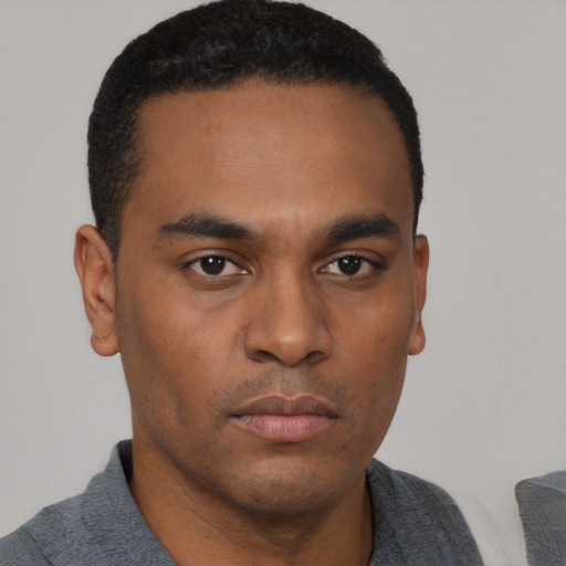 Neutral black young-adult male with short  black hair and brown eyes
