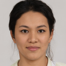 Joyful asian young-adult female with medium  brown hair and brown eyes