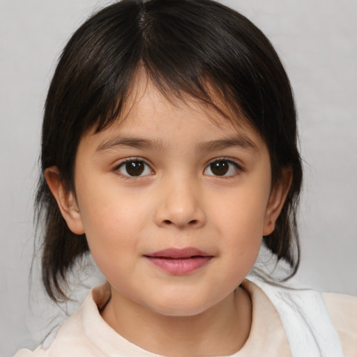 Joyful white child female with medium  brown hair and brown eyes