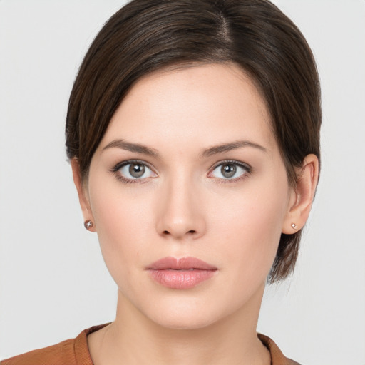 Neutral white young-adult female with short  brown hair and brown eyes