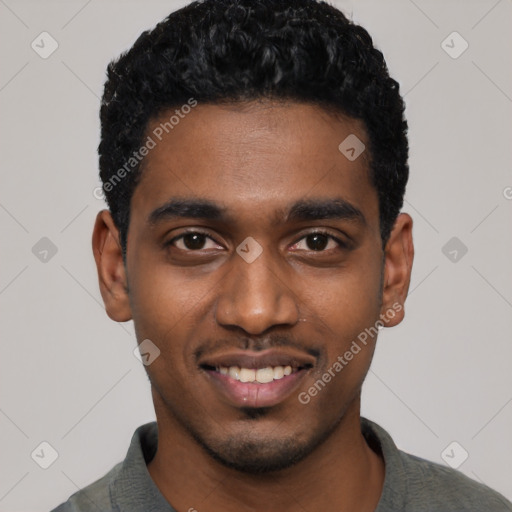 Joyful black young-adult male with short  black hair and brown eyes