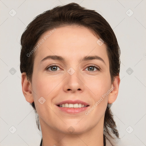 Joyful white young-adult female with short  brown hair and grey eyes