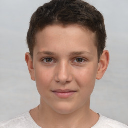 Joyful white child male with short  brown hair and brown eyes