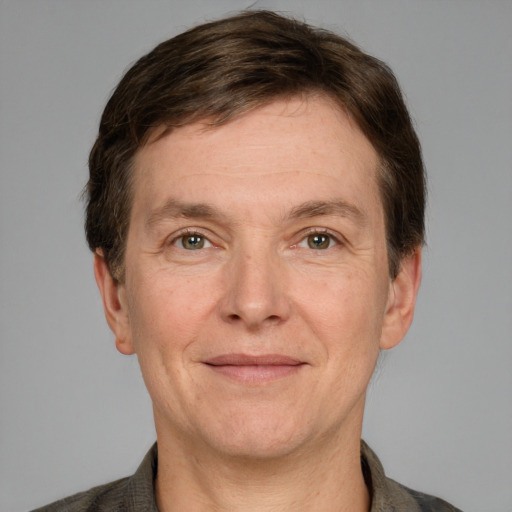 Joyful white adult male with short  brown hair and grey eyes