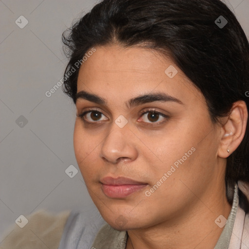 Joyful latino young-adult female with short  brown hair and brown eyes