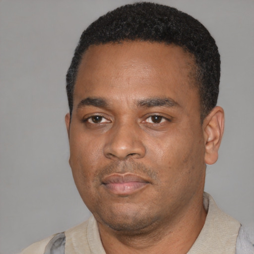 Neutral latino adult male with short  black hair and brown eyes