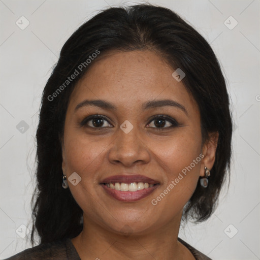 Joyful black adult female with medium  brown hair and brown eyes