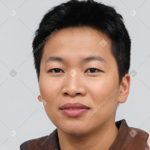 Joyful asian young-adult male with short  black hair and brown eyes