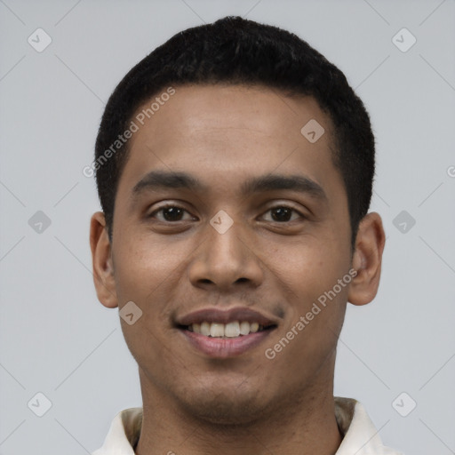 Joyful latino young-adult male with short  black hair and brown eyes