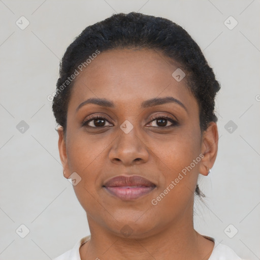 Joyful black young-adult female with short  brown hair and brown eyes