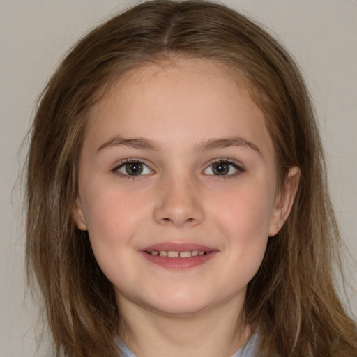 Joyful white child female with long  brown hair and brown eyes