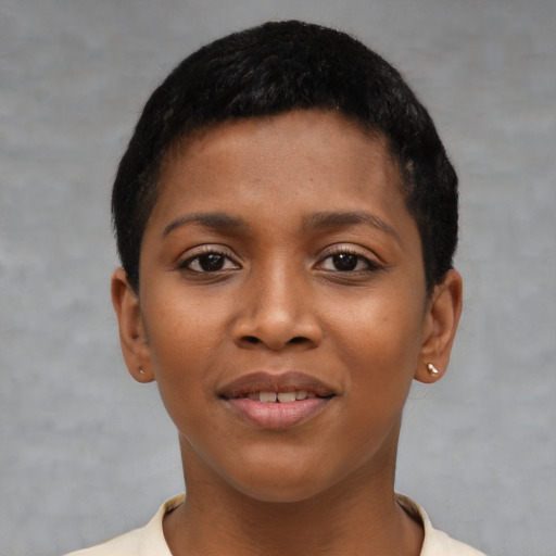 Joyful black young-adult female with short  brown hair and brown eyes