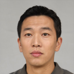 Neutral asian adult male with short  black hair and brown eyes