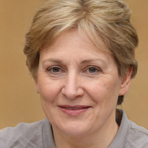 Joyful white middle-aged female with short  brown hair and brown eyes