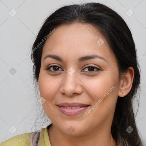 Joyful latino young-adult female with long  brown hair and brown eyes