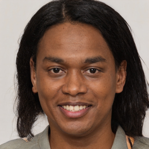 Joyful latino adult male with medium  brown hair and brown eyes
