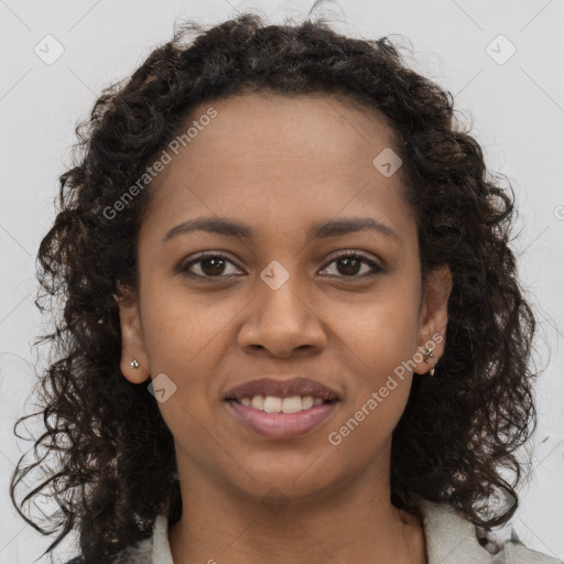 Joyful black young-adult female with long  brown hair and brown eyes