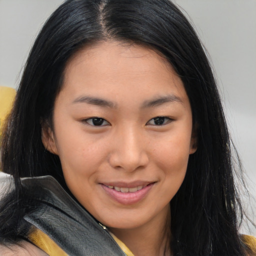 Joyful asian young-adult female with long  brown hair and brown eyes