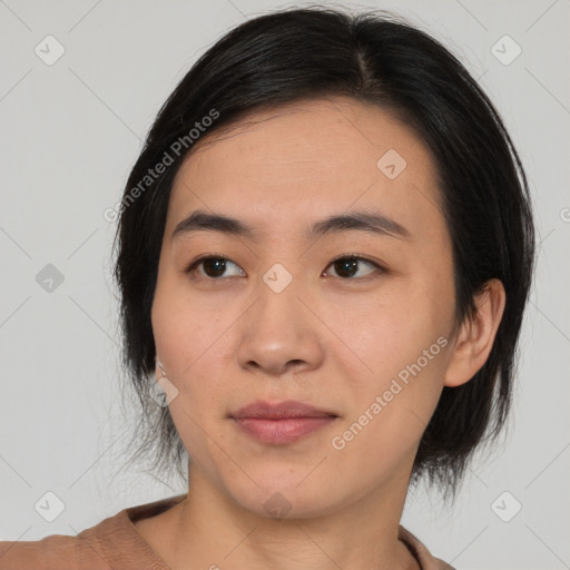 Joyful asian young-adult female with medium  black hair and brown eyes