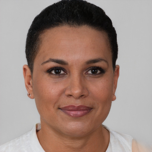 Joyful black young-adult female with short  brown hair and brown eyes