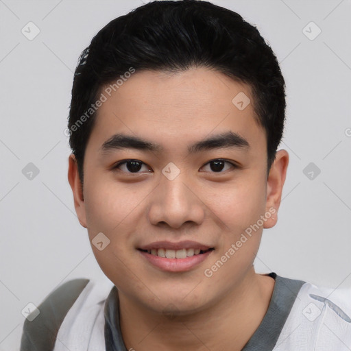 Joyful asian young-adult male with short  black hair and brown eyes