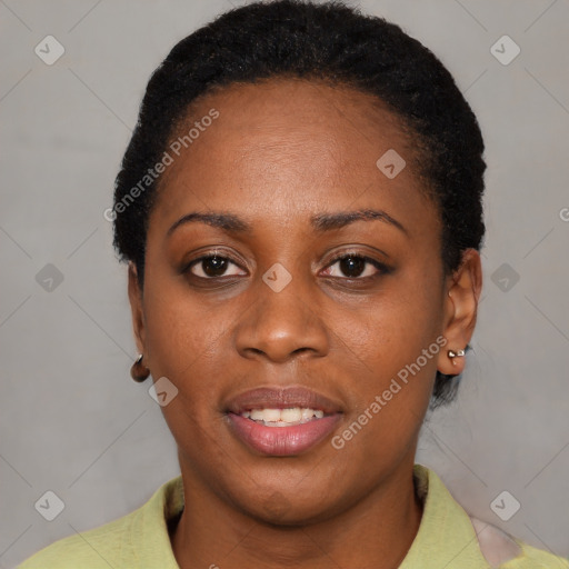 Joyful black young-adult female with short  brown hair and brown eyes