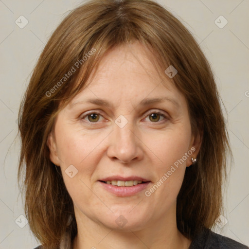 Joyful white adult female with medium  brown hair and grey eyes