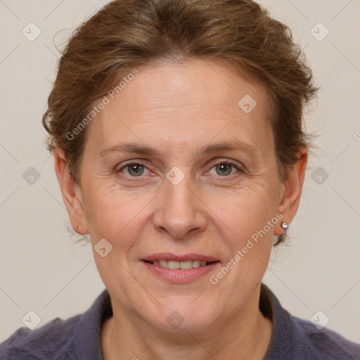 Joyful white adult female with short  brown hair and grey eyes