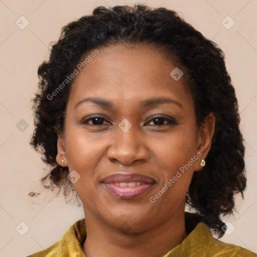 Joyful black adult female with medium  brown hair and brown eyes