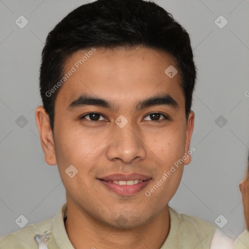 Joyful latino young-adult male with short  brown hair and brown eyes