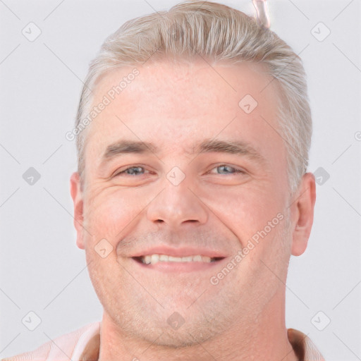 Joyful white adult male with short  brown hair and grey eyes