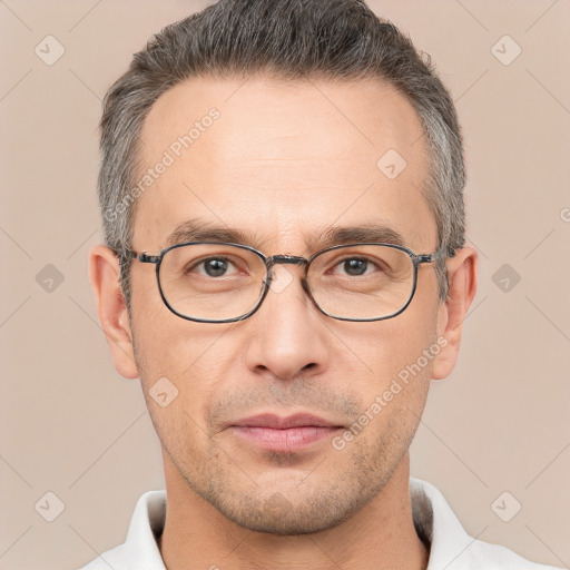 Neutral white adult male with short  brown hair and brown eyes