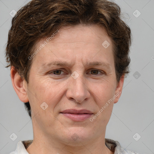 Joyful white adult male with short  brown hair and grey eyes