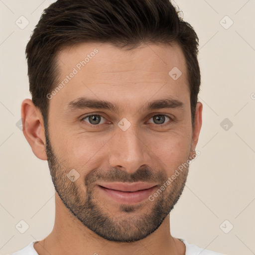 Joyful white young-adult male with short  brown hair and brown eyes