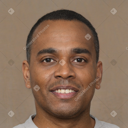 Joyful latino young-adult male with short  brown hair and brown eyes