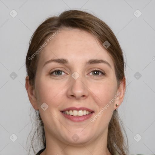 Joyful white adult female with medium  brown hair and grey eyes