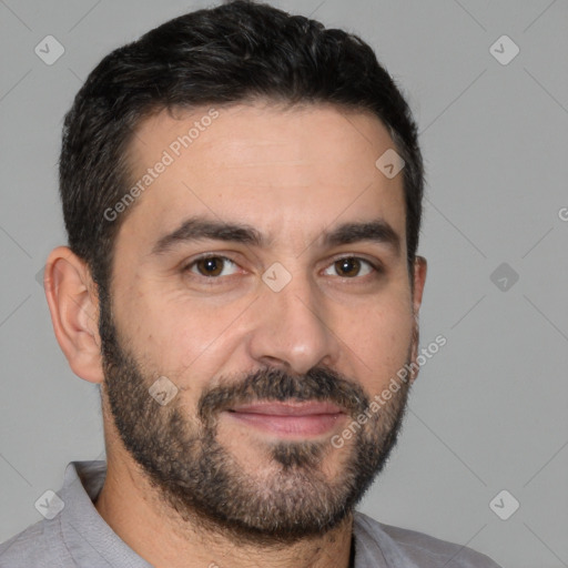 Joyful white young-adult male with short  black hair and brown eyes