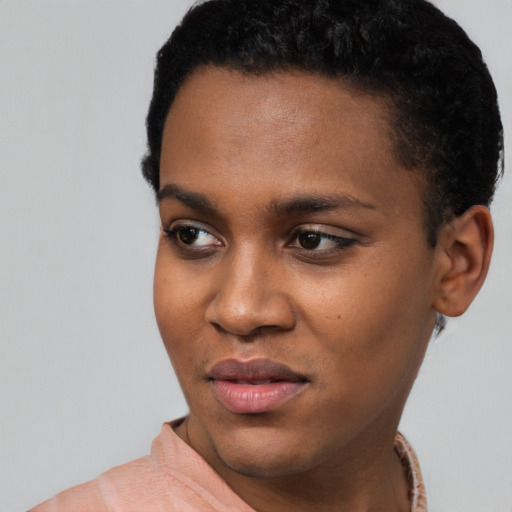 Joyful latino young-adult female with short  black hair and brown eyes