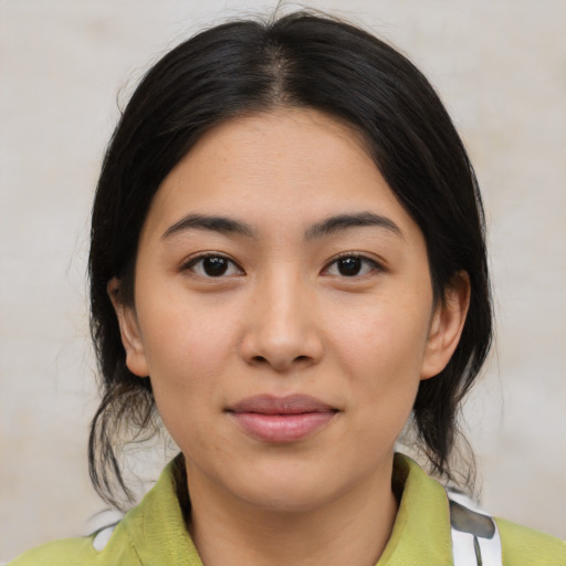 Joyful latino young-adult female with medium  brown hair and brown eyes