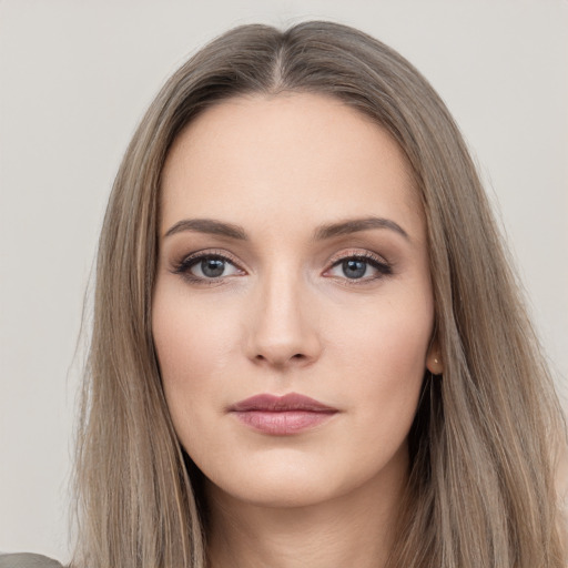 Neutral white young-adult female with long  brown hair and brown eyes