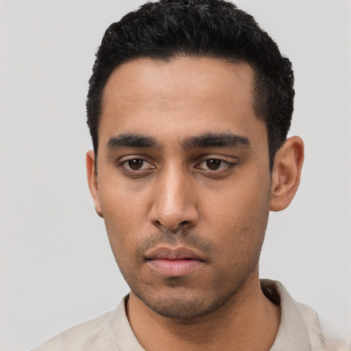 Neutral latino young-adult male with short  black hair and brown eyes