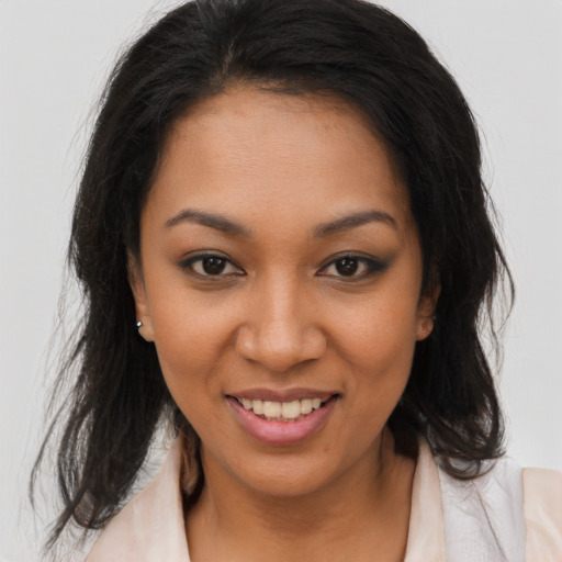 Joyful latino young-adult female with medium  brown hair and brown eyes